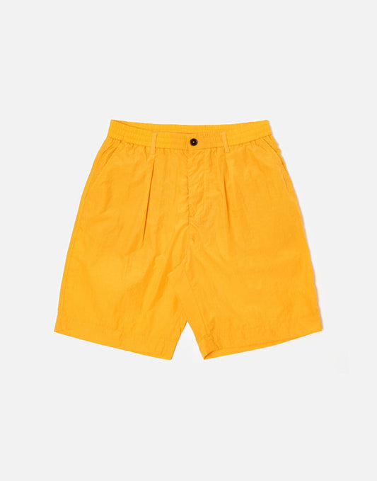 Universal Works Pleated Track Short In Orange Recycled Nylon Tech